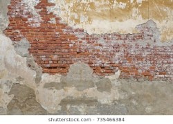 beige-plastered-brickwall-chipped-stucco-260nw-735466384