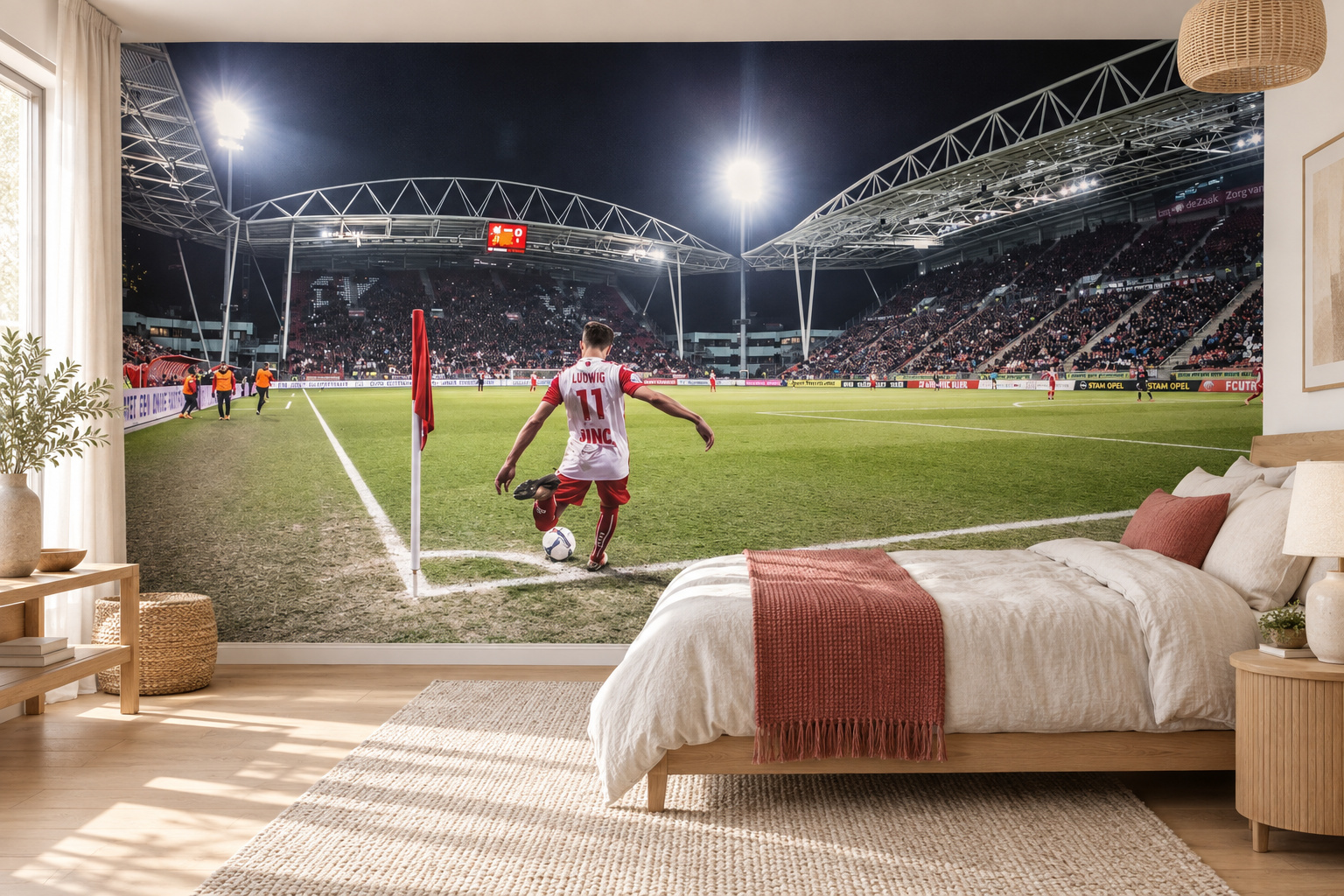 Voetbalstadion bij nacht als slaapkamerbehang met een speler bij de hoekvlag en een bed rechts.